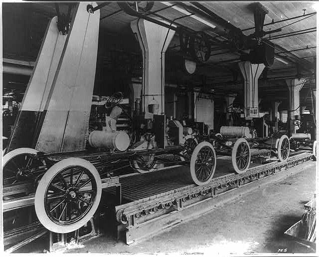 Henry Ford's assembly line producing Model T cars.